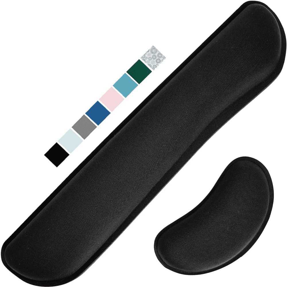 A memory foam wrist rest placed in front of a keyboard and mouse to provide support and reduce typing fatigue.
