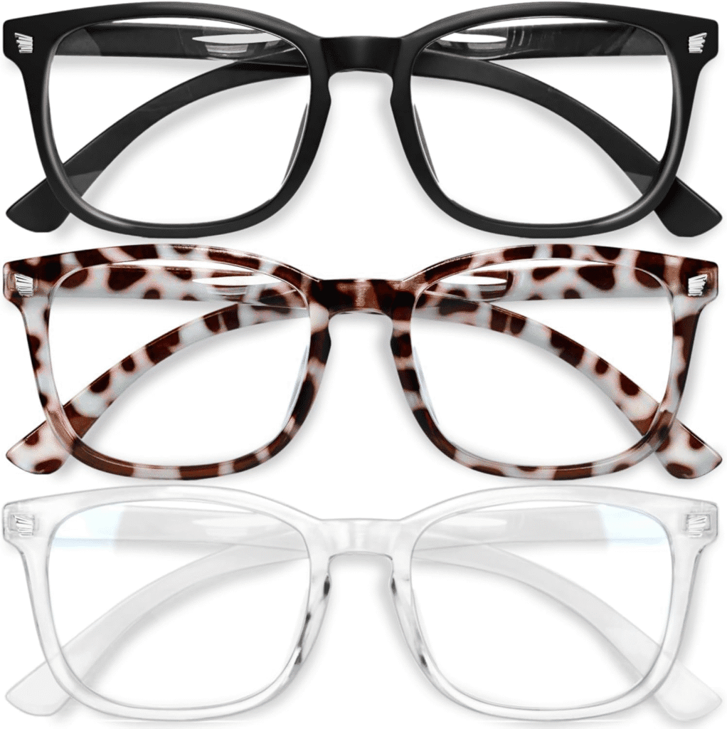 A pair of blue light blocking glasses resting next to a laptop, designed to reduce eye strain from screen exposure.